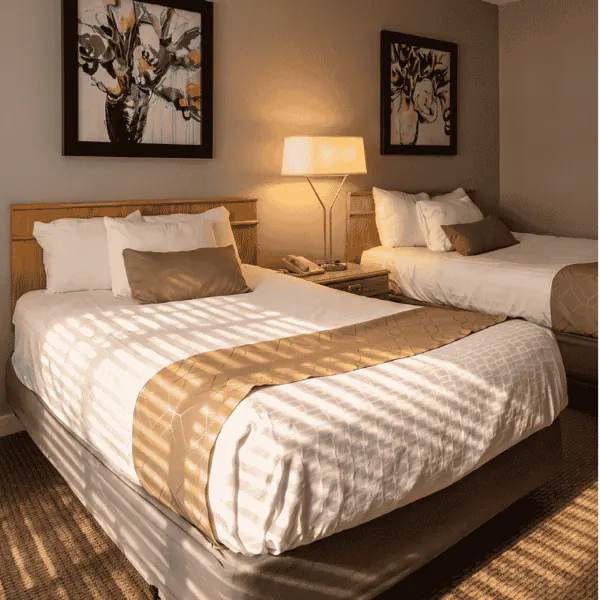 Two queen beds side by side in a standard room